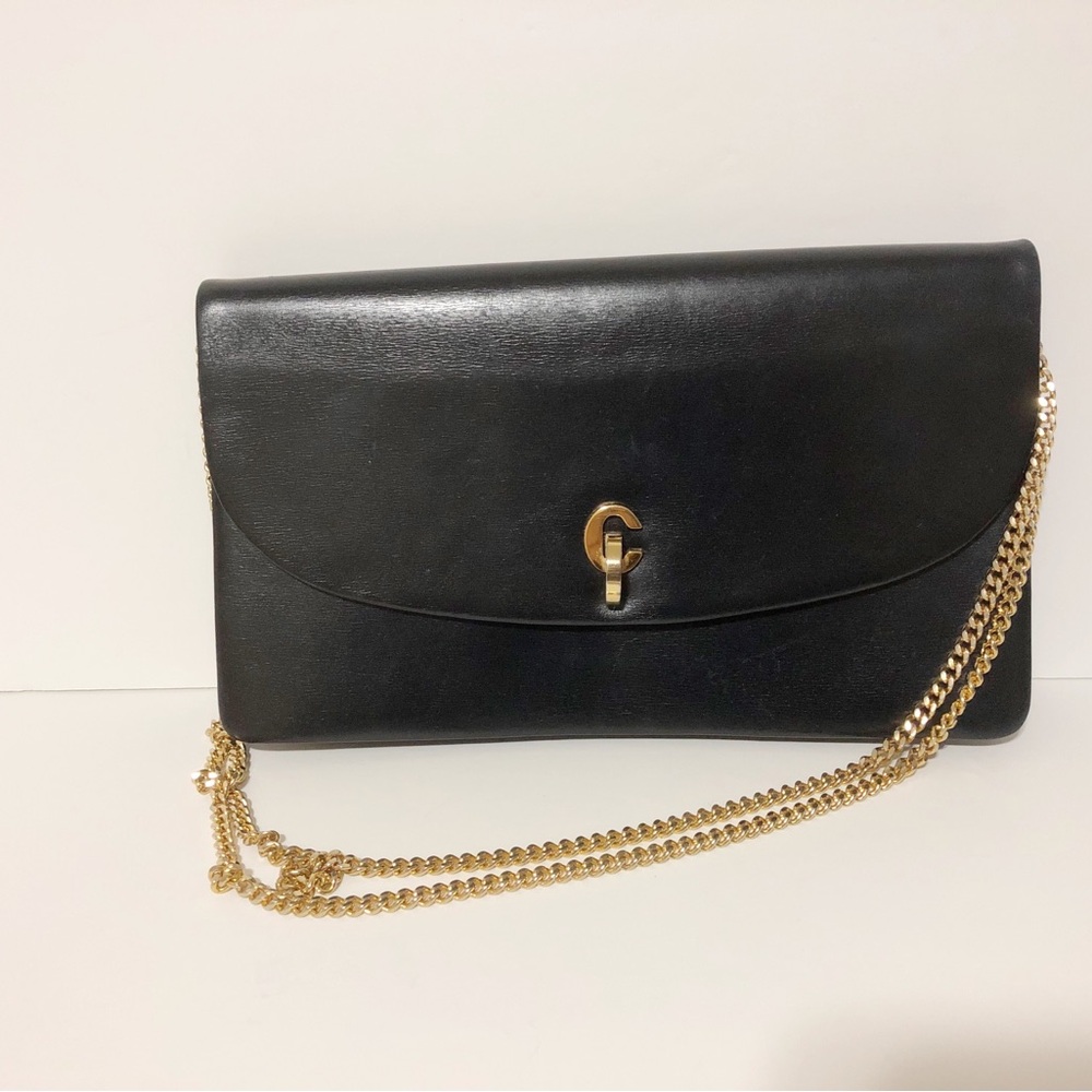 Authentic Dior black leather clutch bag with golden hardware